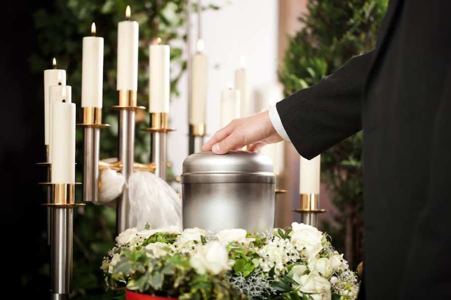 funeral-urn-with-candles-flowers