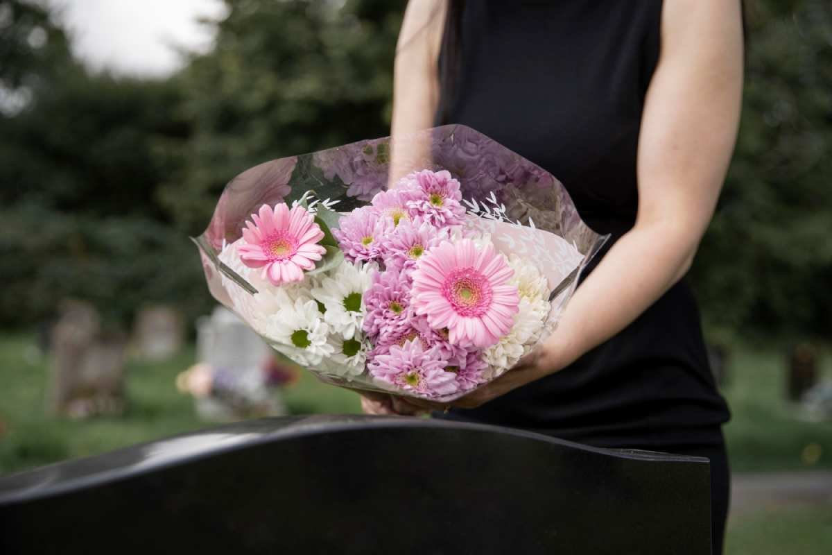 woman-visiting-grave-loved-one